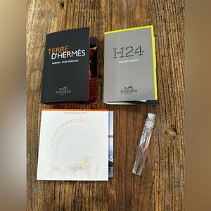 Hermes fragrance sample set in black, gray, white, neon yellow accents